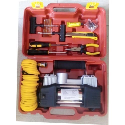 Double-cylinder car tyre inflator air compressor pump on white background.