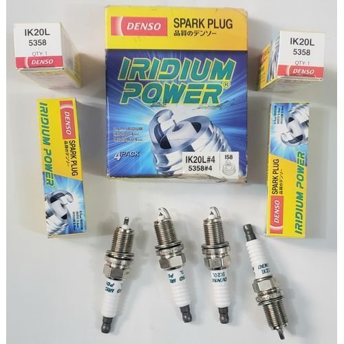 Set of four Denso 5358 Iridium Power spark plugs on white background