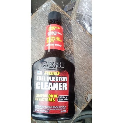 ABRO Injector Cleaner bottle with red and white label on white background