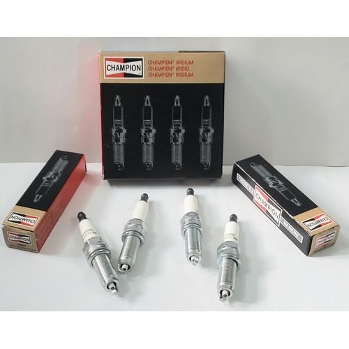 et of four Champion 9407 Iridium spark plugs on a white background.